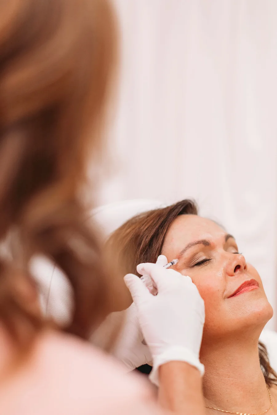 A provider performing an injectable treatment at The Look Aesthetics
