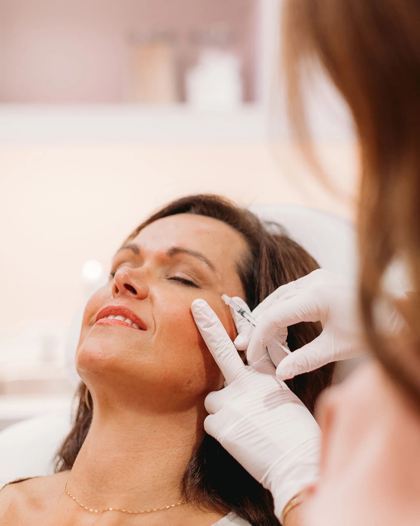 A provider preparing a DAXXIFY treatment for a patient at The Look